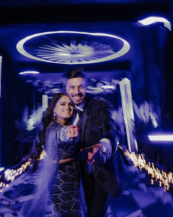 I love using creative techniques like motion blur to capture the whirlwind energy of a Sangeet night. This shot freezes the couple's happy faces while the background swirls with light and movement, perfectly depicting the festive atmosphere.