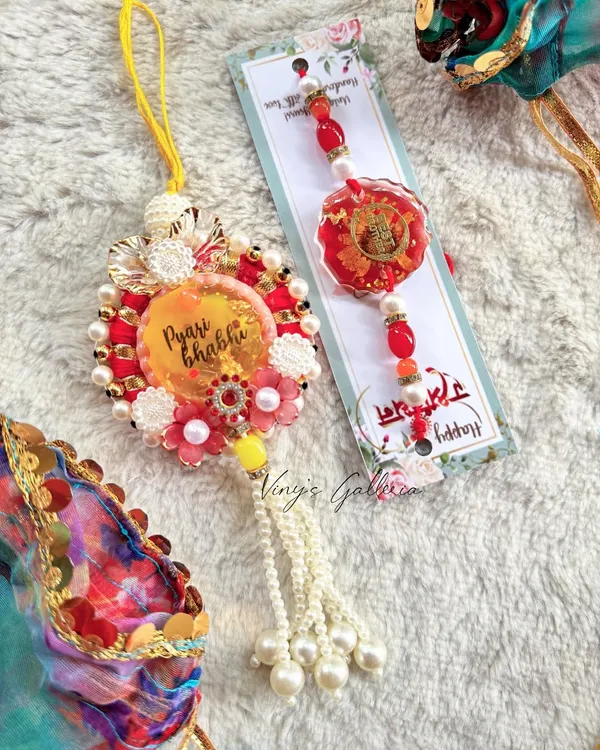 This Raksha Bandhan, gift your brother and bhabhi a one-of-a-kind rakhi set. This beautiful lumba for your "Pyari Bhabhi" is purely handcrafted, with no copies, just like your special bond.