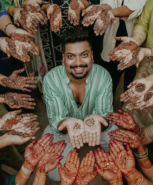 Mehendi is for everyone. I love it when the groom and the whole family get involved. This is what it's all about: creating memories together.