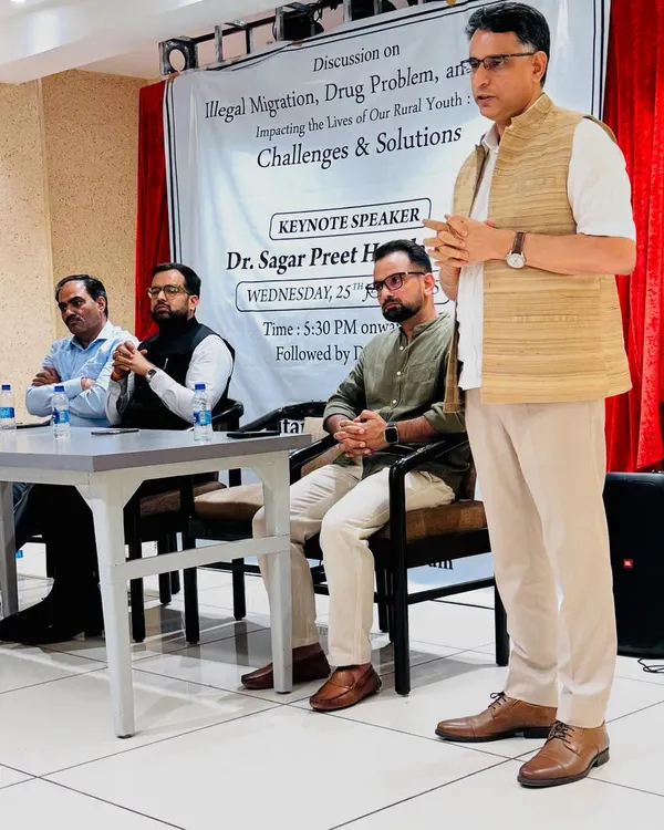 Participating in a discussion on illegal migration and drug problems affecting rural youth, alongside a Special Commissioner of Delhi Police.