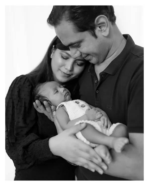 This is the quiet magic I live to capture. In the gentle hold of new parents, a whole universe of love is born. I focus on these profound, unspoken connections that you will cherish for a lifetime.