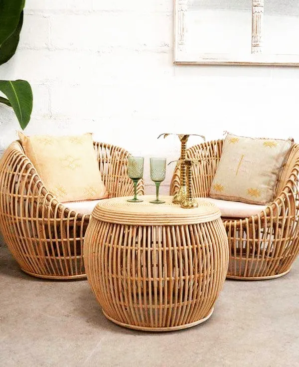 This cozy seating arrangement features our deep, rounded rattan armchairs and a matching drum-style coffee table. The natural finish and comfortable design make this set perfect for a relaxed living room or a sheltered patio space.