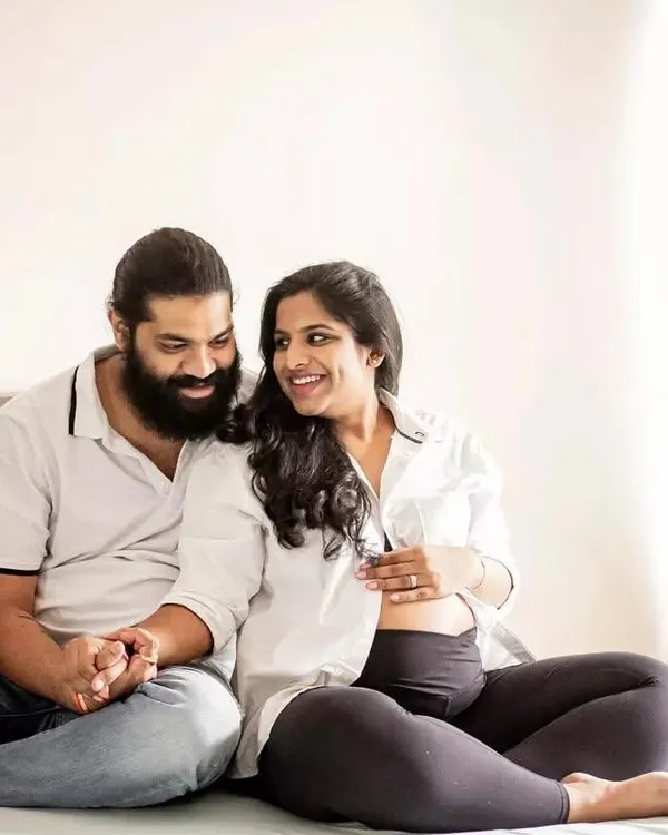 An in-home maternity session is perfect for capturing your real life. This couple shared a sweet, relaxed moment on their bed, just being themselves.
