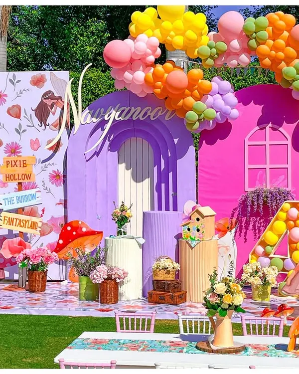 I transformed this backyard into an enchanting fairyland for a magical 4th birthday. This immersive setup features a custom-built fairy house backdrop, vibrant balloon garlands, and whimsical details that invite little guests into a world of wonder.