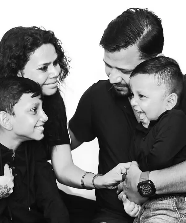 A beautiful black and white family portrait that captures a moment of laughter and connection. This style is perfect for creating classic, emotional images that will never go out of style.