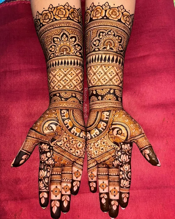 This stunning ring ceremony design is filled with beloved traditional symbols. I combined floral patterns with peacock and elephant motifs to create a rich, celebratory look perfect for an engagement.