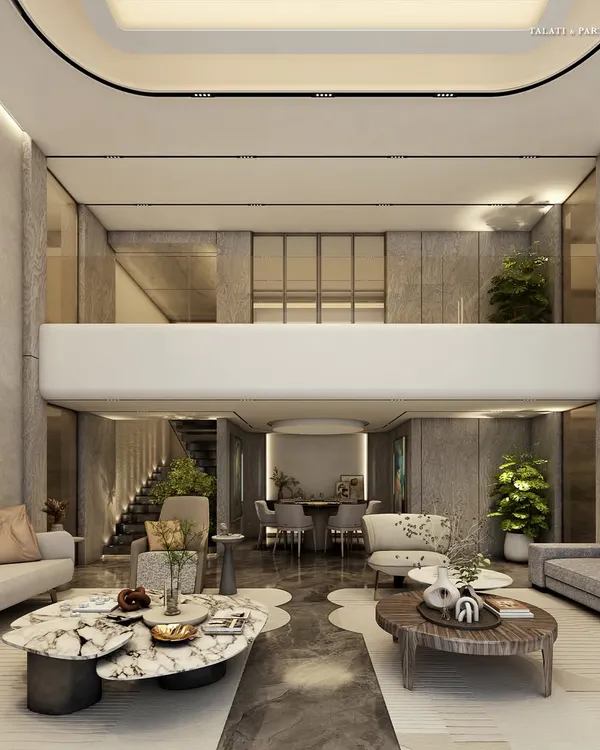 A double-height living room where minimalism breathes luxury. Every element, from the subdued color palette to the sleek lines of the mezzanine, is meticulously selected to craft a tranquil sanctuary that feels both grand and intimate.