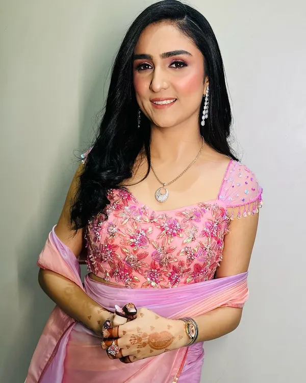 This is a perfect example of a soft and pretty Roka makeup look. I used shades of pink on the eyes and cheeks to create a fresh, youthful glow that beautifully complements her pink and lavender outfit.