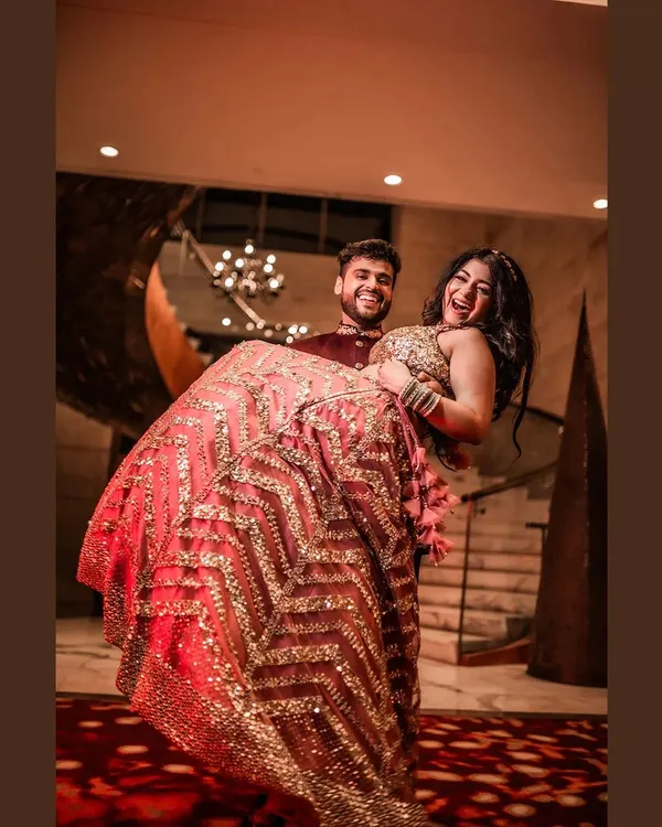 This is the 'Rab banai jodi' vibe I live to capture. The pure, uncontainable joy of the groom lifting his bride, surrounded by the warmth of their celebration. It’s moments like these, full of laughter and love, that become the heart of your wedding story.