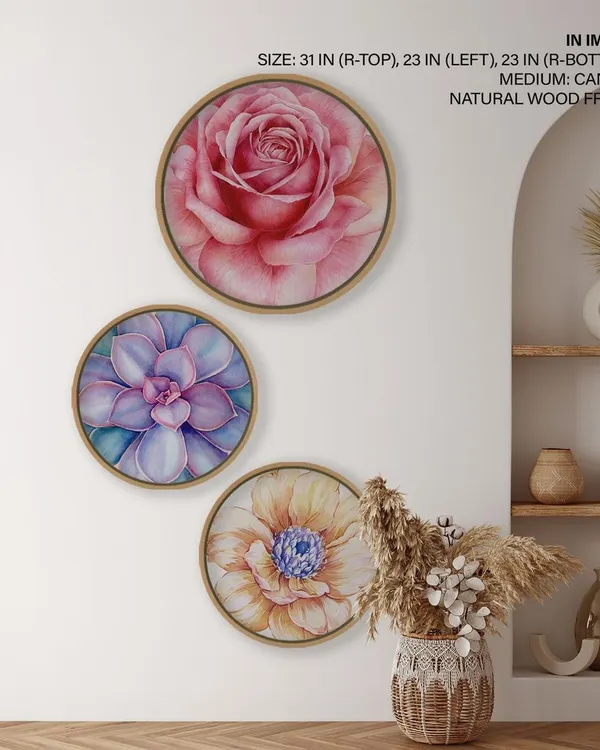 A vibrant set of three circular watercolor flower prints. The detailed rose, succulent, and daisy designs bring a burst of natural beauty and color to your walls.