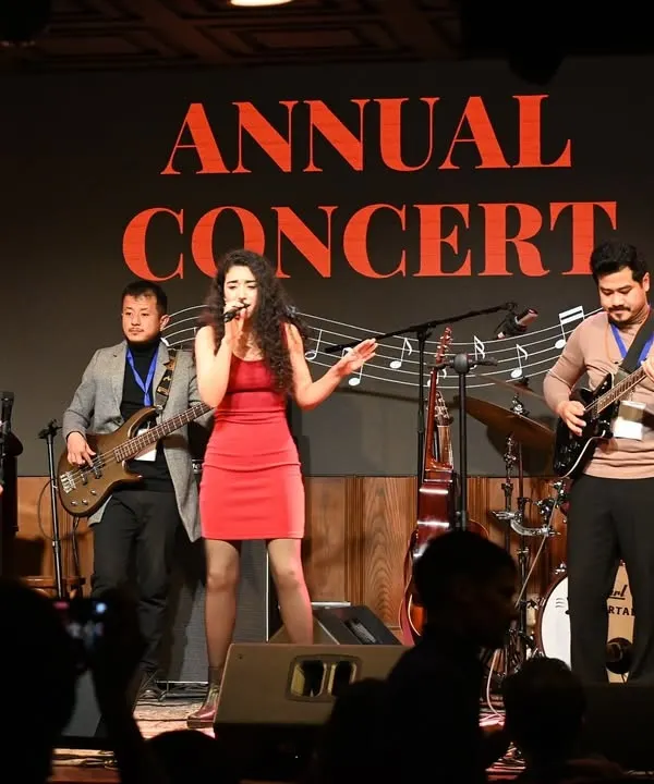This is what it's all about. Our students taking center stage with a full band at our Annual Concert. We provide comprehensive band training to help you find your voice and rock out with fellow musicians.