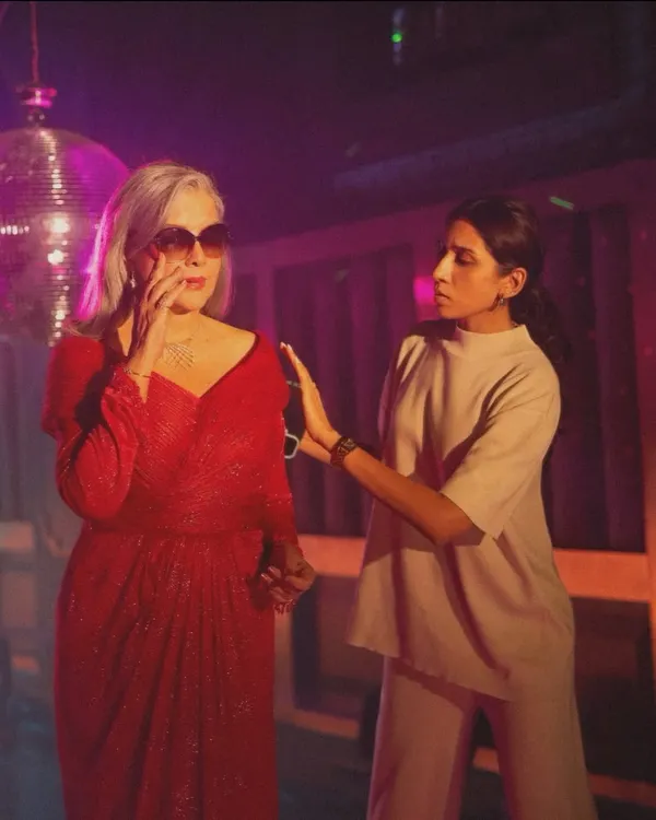 On set with the legendary Zeenat Aman, making final adjustments to the custom red disco gown for the Mia by Tanishq campaign. It was an honor to work so closely with an icon to bring this vibrant, retro-inspired vision to life.
