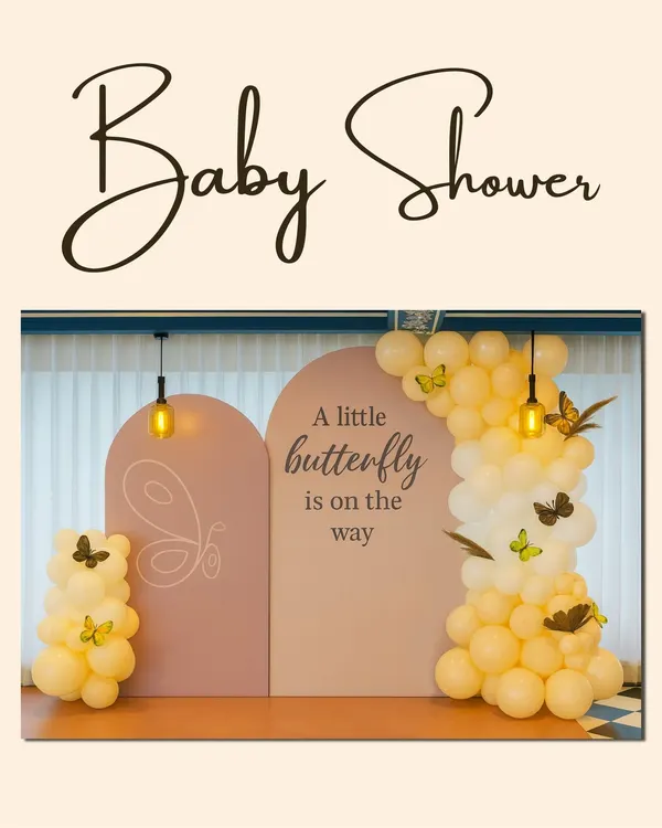 This is the hero item. We brought this dreamy "A little butterfly is on the way" concept to life with a beautiful arched backdrop, a cascade of soft yellow balloons, and delicate butterfly accents. It’s the perfect, elegant photo spot to celebrate the mom-to-be.