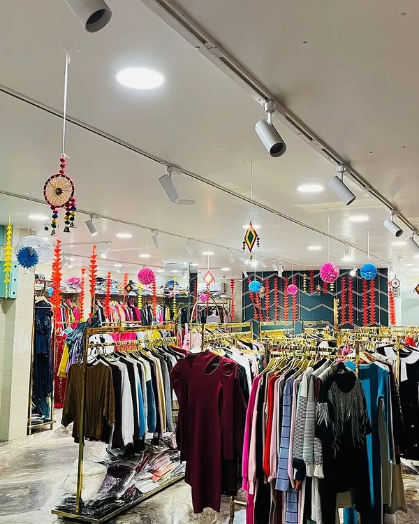 We decorated this retail store for Diwali with traditional hangings and colorful papercrafts. The decor includes marigold garlands, paper pompoms, and dreamcatchers to create a festive shopping atmosphere.