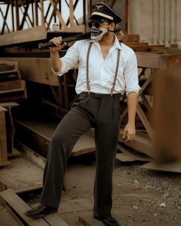 A highly conceptual and edgy photoshoot with a skull mask and baseball bat. This type of creative work is great for making a bold statement in a portfolio or for an artistic project.
