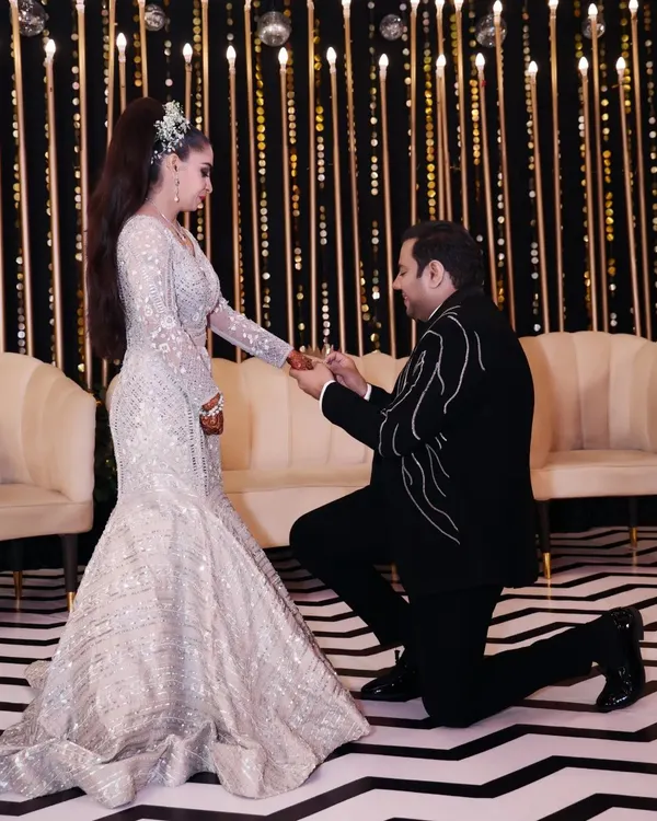 Kneeling down to the soul you love is the best part of life. A classic proposal moment during the engagement ceremony, full of romance and commitment.