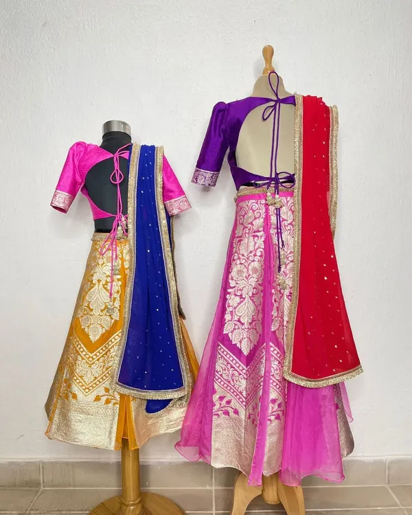 A sister is a first best friend. We designed these handcrafted Banarasi lehengas for two sisters, using vibrant colors and traditional weaves to celebrate their special bond.