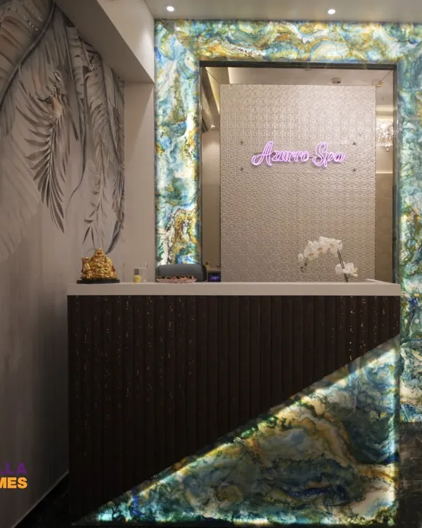 The entrance to Azurro Spa features a striking reception desk framed with backlit agate stone. This design choice immediately establishes a sense of luxury and tranquility, setting the tone for the entire wellness experience.