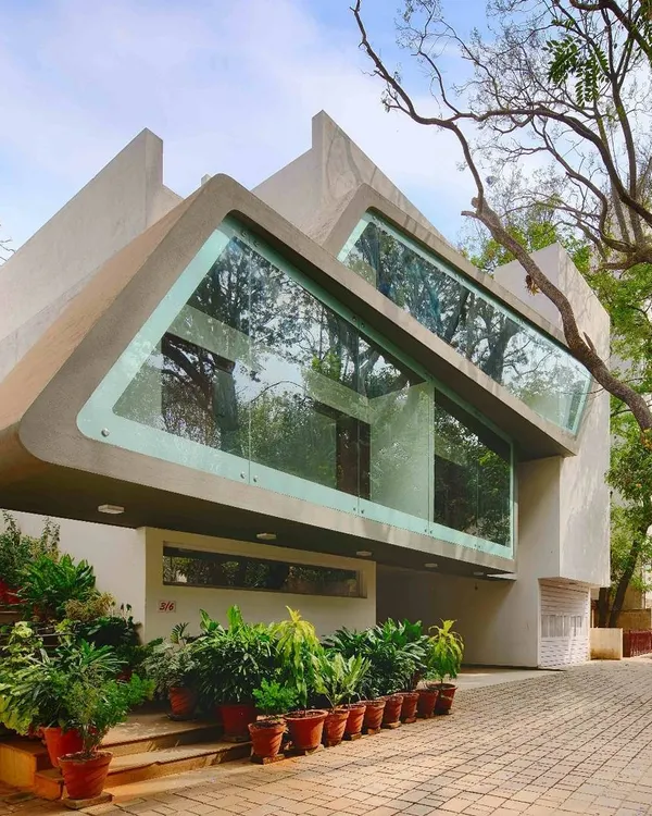 The Mobius Home in Bangalore, where the building's form was shaped by the existing trees. This project exemplifies our commitment to integrating architecture with nature, rather than displacing it.