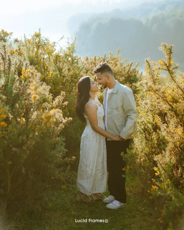 Bathed in the golden hour light of the hills, a couple shares a moment of quiet romance. These natural light portraits are perfect for telling your pre-wedding story.