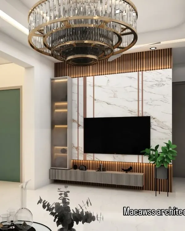 This living room features a striking TV wall with marble and wood fluting, crowned by a magnificent tiered chandelier. It's a perfect example of creating a luxurious focal point in the main living area.
