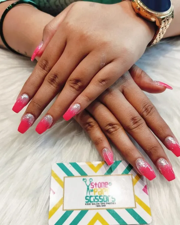 This look combines two effects: a vibrant pink to silver glitter gradient. The ombre effect on these long coffin nails is super glamorous and perfect for making a statement.