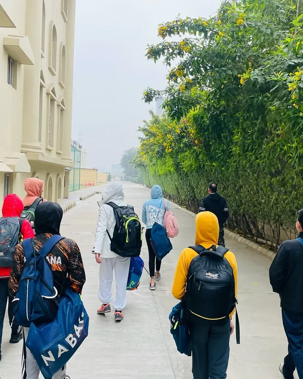 The path to the pool on a cold winter morning. Our swimmers show dedication year round, understanding that consistency is the key to success. We train smart to build champions, no matter the season.