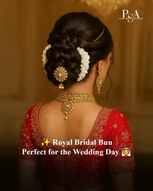 A timeless royal bridal bun, intricately woven and adorned with fresh gajra. This is the kind of classic elegance we love creating for the main wedding ceremony, ensuring it looks perfect from every angle and holds beautifully through the day.
