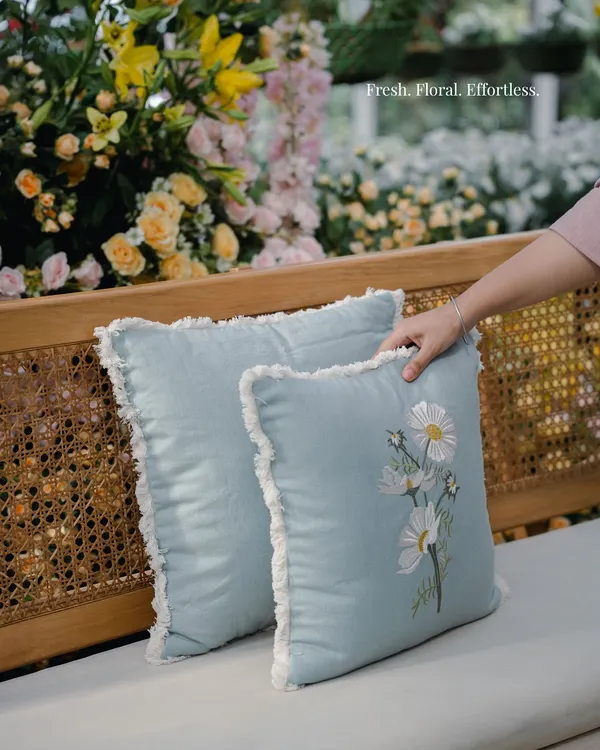 Fresh, floral, and effortless. These light blue cushions with delicate embroidered daisies were chosen for the Mussoorie Haldi to add a soft, fresh touch to the rattan seating.