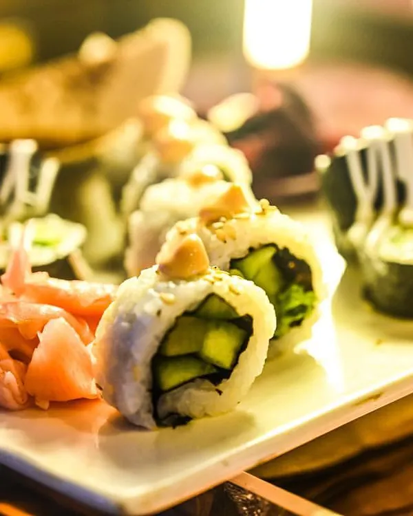 A close-up of our expertly prepared Japanese sushi, served with pickled ginger and wasabi. Our Pan-Asian selection brings delicate and authentic flavors to your event menu.