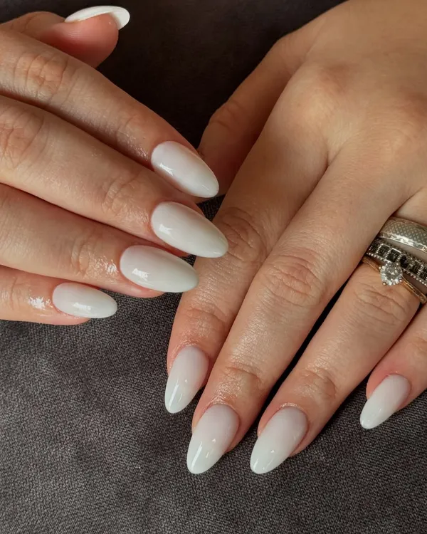 Pure, chic, and effortlessly classy. A beautiful set of milky white gel extensions in a flattering almond shape.