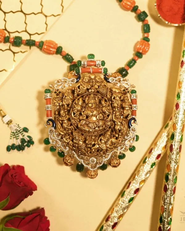 This is a piece of artistry that tells a story of gods and kings. A traditional temple jewellery necklace, hand-carved in gold and adorned with precious gems, it is more than an accessory; it is a wearable masterpiece of our culture.