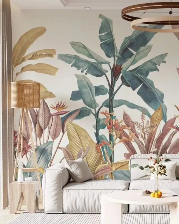 This living room features a soft, pastel-toned tropical wallpaper that creates a calm and airy feel. The design is detailed yet gentle, perfectly complementing the minimalist furniture and modern decor for a sophisticated nature-inspired look.