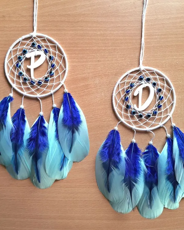 Protect your journey with our personalized evil eye dreamcatcher car hangings. This pair, customized with the initials 'P' and 'D', combines spiritual protection with a personal touch.