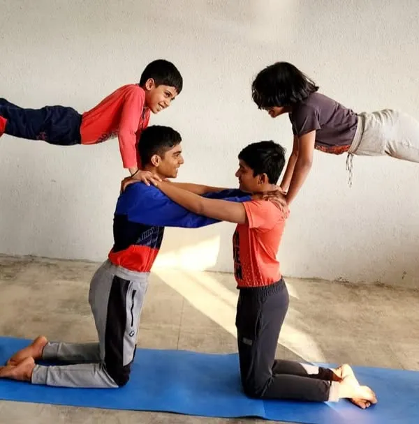 We believe in reaching new heights together. This group acrobatic pose is a perfect example of the teamwork, trust, and physical strength our campers develop in a fun and supportive setting.
