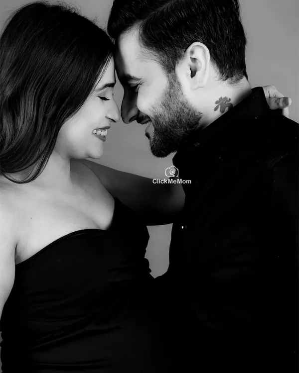 Pure connection, captured in timeless black and white. This intimate close-up focuses on the joyful and loving expressions between the couple, creating a powerful and emotional memory.