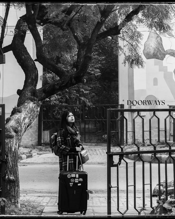 The cover shot for my 'Doorways' series. For me, this image of a woman with her luggage represents the start of a journey, a search for warmth and home in a new city.