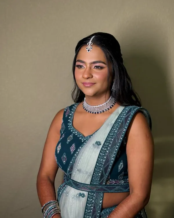 A soft glam look perfect for a reception or sangeet. I paired a shimmering eye with a rosy lip and a flawless, dewy base to complement her beautiful teal and silver lehenga.