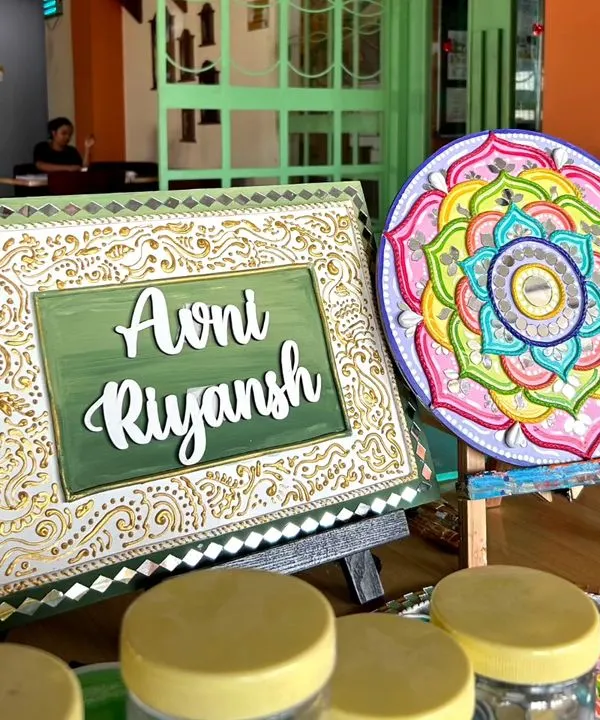 Here are two beautiful examples of the traditional art we create in my Lippan art workshop. One is a nameplate and the other is a stunning mandala, both featuring intricate mirror work and clay details.