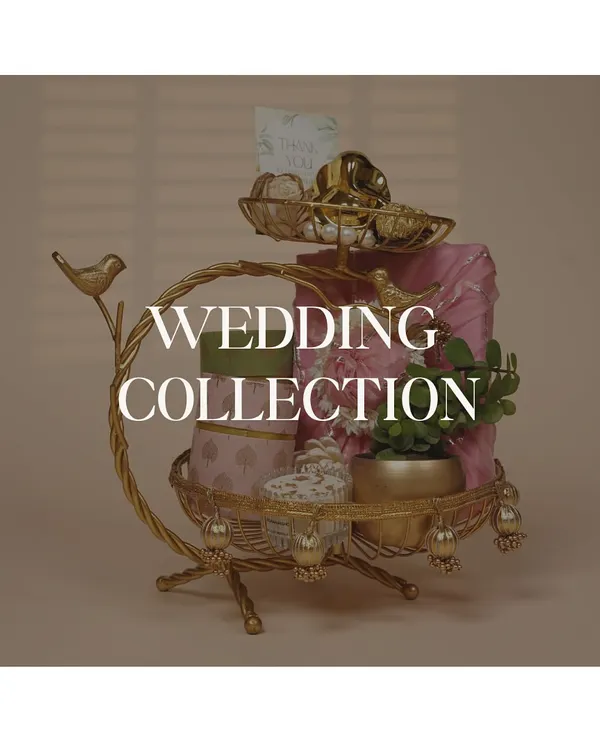 An overview of my wedding collection, featuring a stunning two-tiered gold stand filled with beautifully packaged gifts, perfect as a centerpiece or a luxury present for the bride and groom.