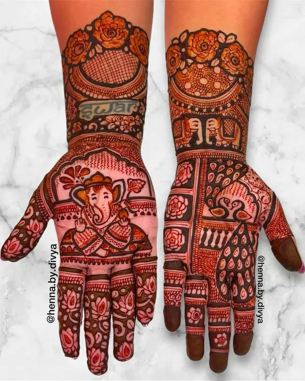 A divine design for Ganesh Chaturthi, featuring a beautifully detailed portrait of Lord Ganesha on the palm. The phrase "Shree Ganeshay Namah" is written above, surrounded by lotus and floral patterns.