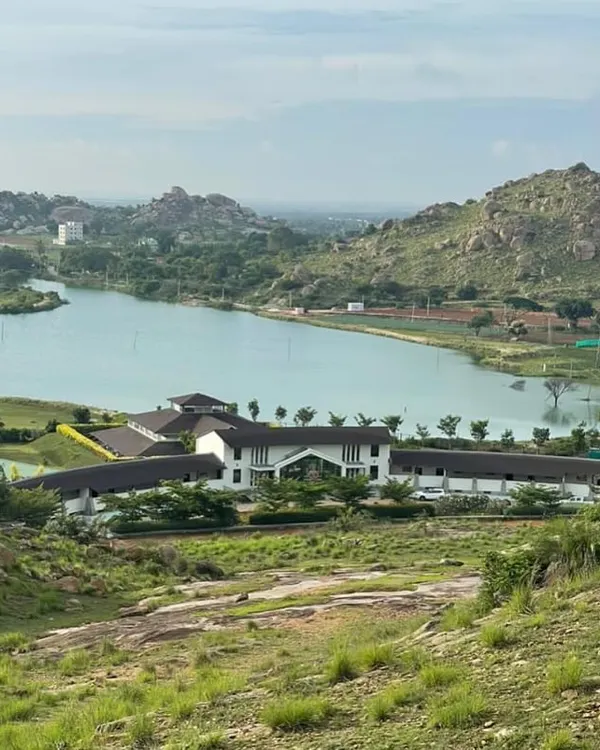 This is my retreat, nestled between the hills and the lake. I built this place as a complete ecosystem for healing, where every view is a part of your therapy.