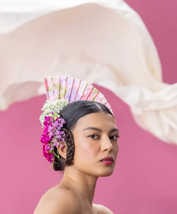 A study in surreal elegance, this shot blends bold floral artistry with a contemporary silhouette. My creative direction focused on creating a dreamlike, high-fashion narrative through handcrafted textures and a striking color palette, celebrating both femininity and strength.