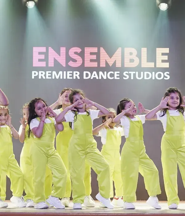 A group of our young dancers strikes a pose during their performance at the 'WSS-25' showcase. Their synchronized movements and expressive faces capture the fun of performing together.