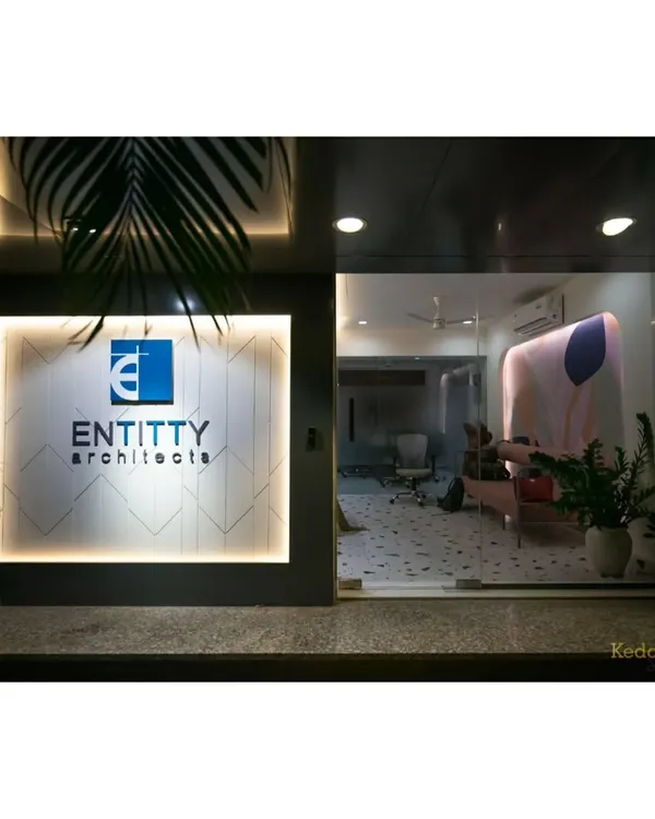 The entrance to our studio, where our backlit logo greets clients. The glass facade offers a glimpse into the creative and welcoming atmosphere we've cultivated inside.
