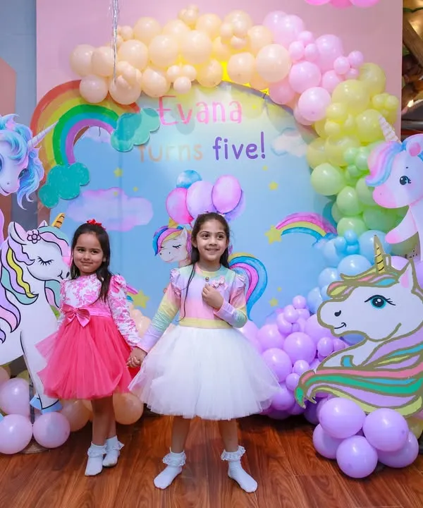 A beautiful unicorn-themed setup for a 5th birthday. We use a stunning backdrop, life-sized unicorn cutouts, and a pastel balloon cloud to create a whimsical and dreamy atmosphere.