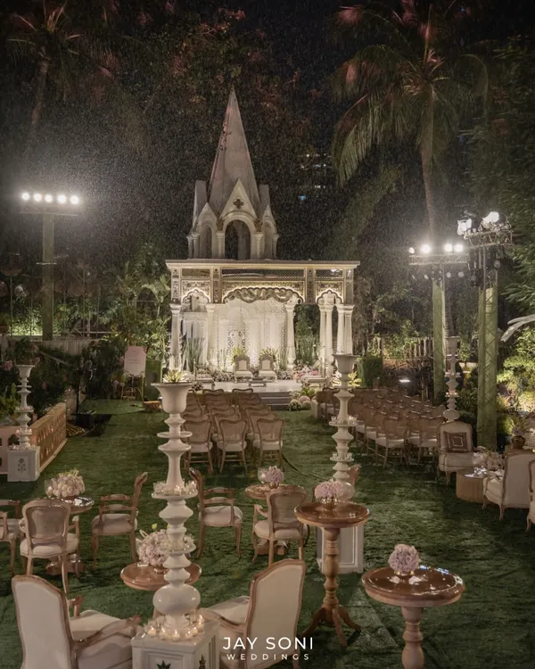 This is what I mean by creating a dream. For this magnificent outdoor wedding, I designed a breathtaking scene with a grand, illuminated mandap set against a lush garden, using soft lighting and elegant seating to craft an atmosphere of pure magic.