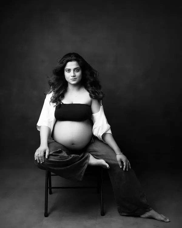 This is one of my favorite black and white portraits. It's modern, confident, and the monochrome tones emphasize her powerful presence and the beauty of her form.