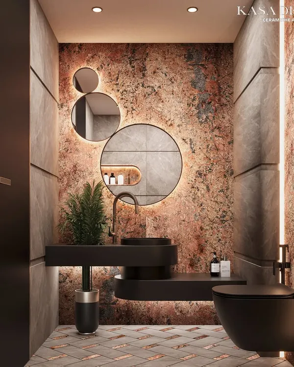This is where I push the boundaries of what a washroom can be. I used our bold Red Ruptura stone for the accent wall to create an immersive, dramatic feel, contrasting it with custom paneling and a fusion tile-and-marble floor. Every element, from the lighting to the matte black fixtures, is designed to craft a memorable experience.
