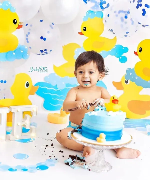 This is what it's all about! That first taste of birthday cake is always the sweetest moment. I love capturing the pure joy and adorable mess of a cakesmash, and this ducky theme is one of my most requested setups for a fun, splashy celebration.